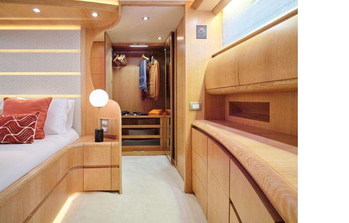 a room with a bed and a mirror aboard IRENE'S Yacht for Charter