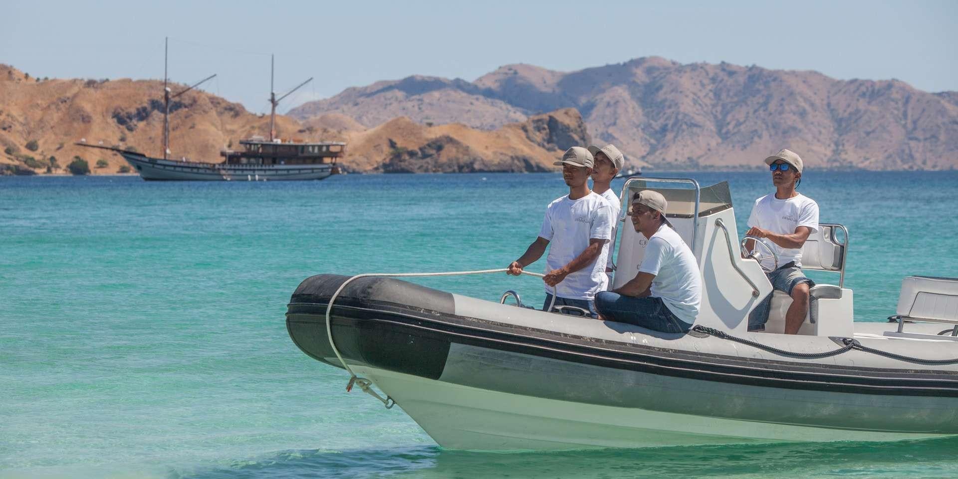 a group of men in a boat aboard PRANA Yacht for Charter