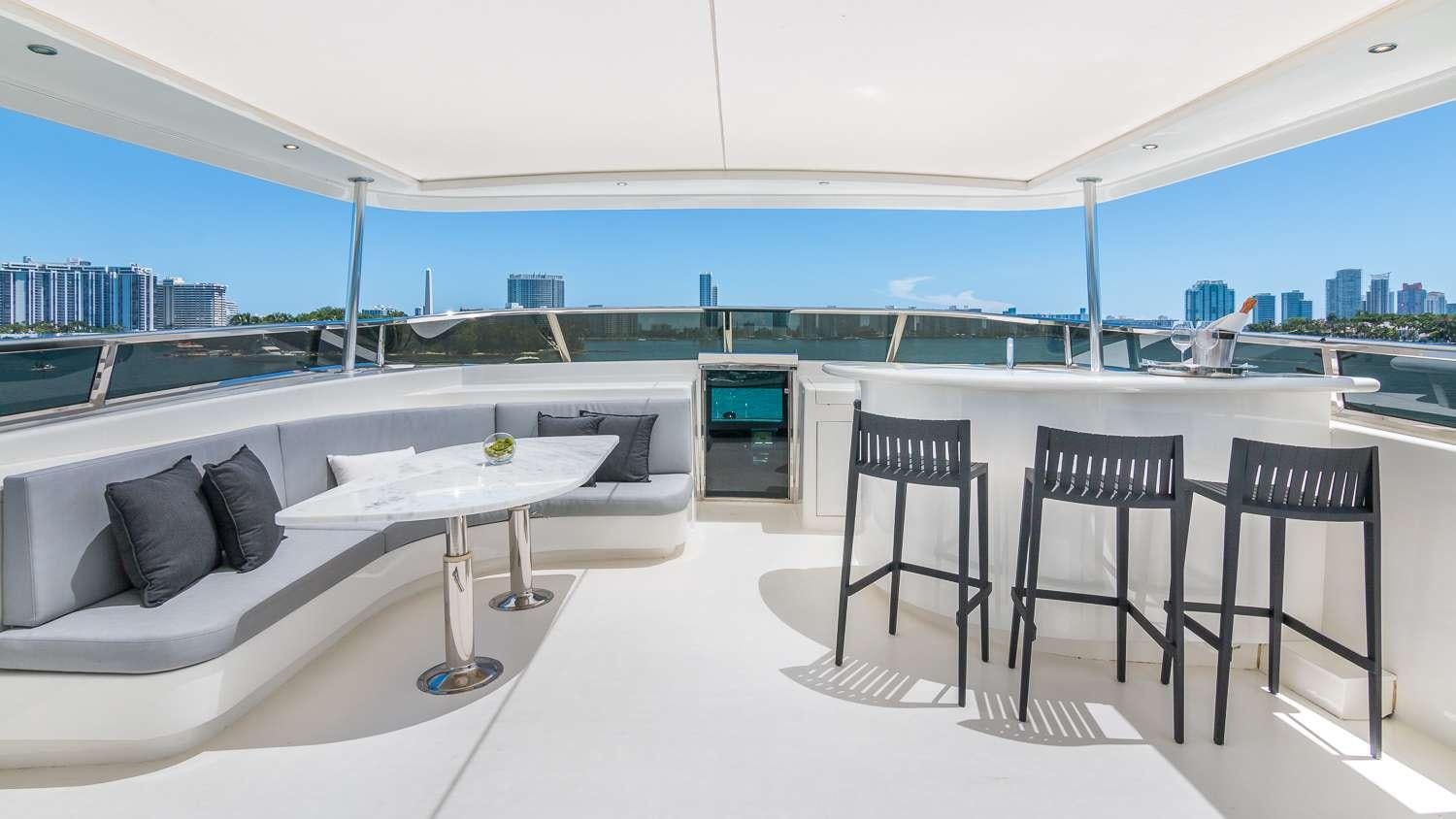 a room with a table and chairs aboard NIRVANA Yacht for Charter