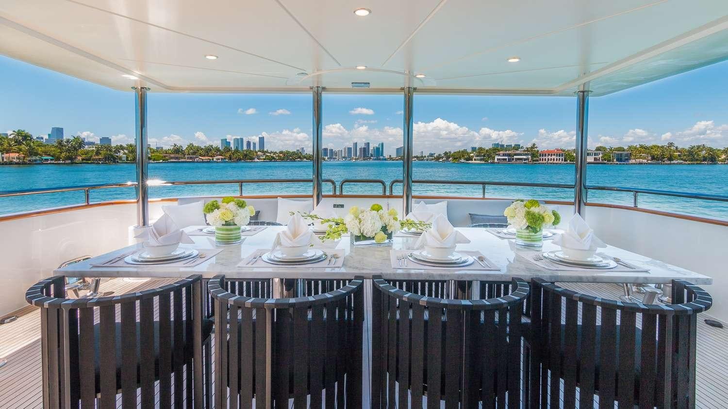 a table set for a dinner aboard NIRVANA Yacht for Charter