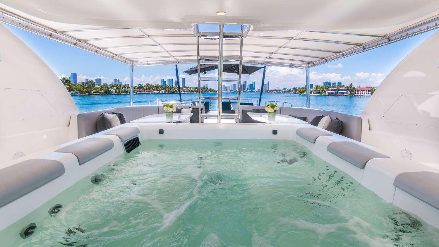 a pool with a large deck aboard NIRVANA Yacht for Charter