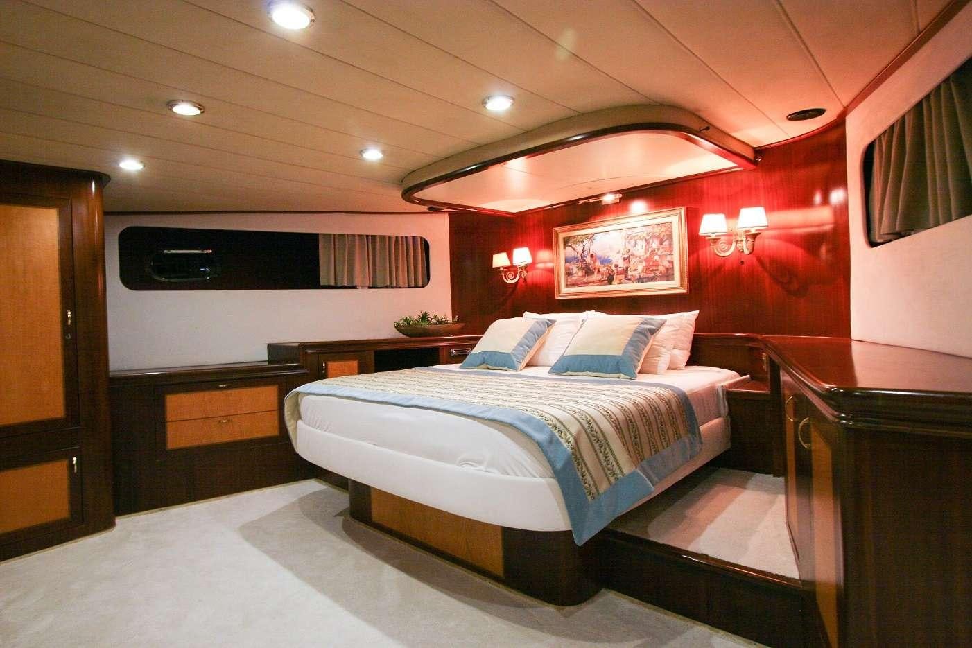 a bed in a room aboard CANEREN Yacht for Charter