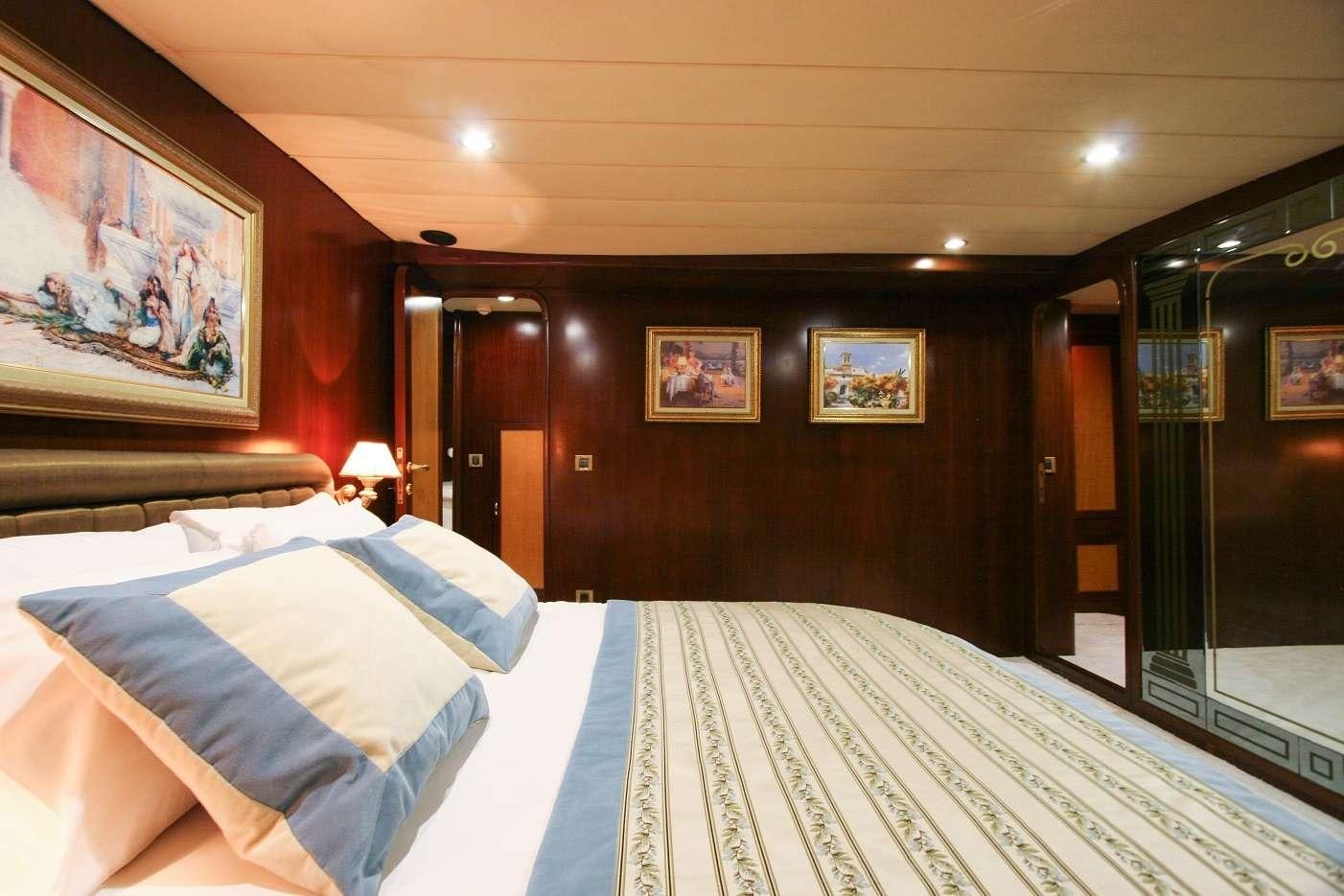 a hotel room with a bed aboard CANEREN Yacht for Charter