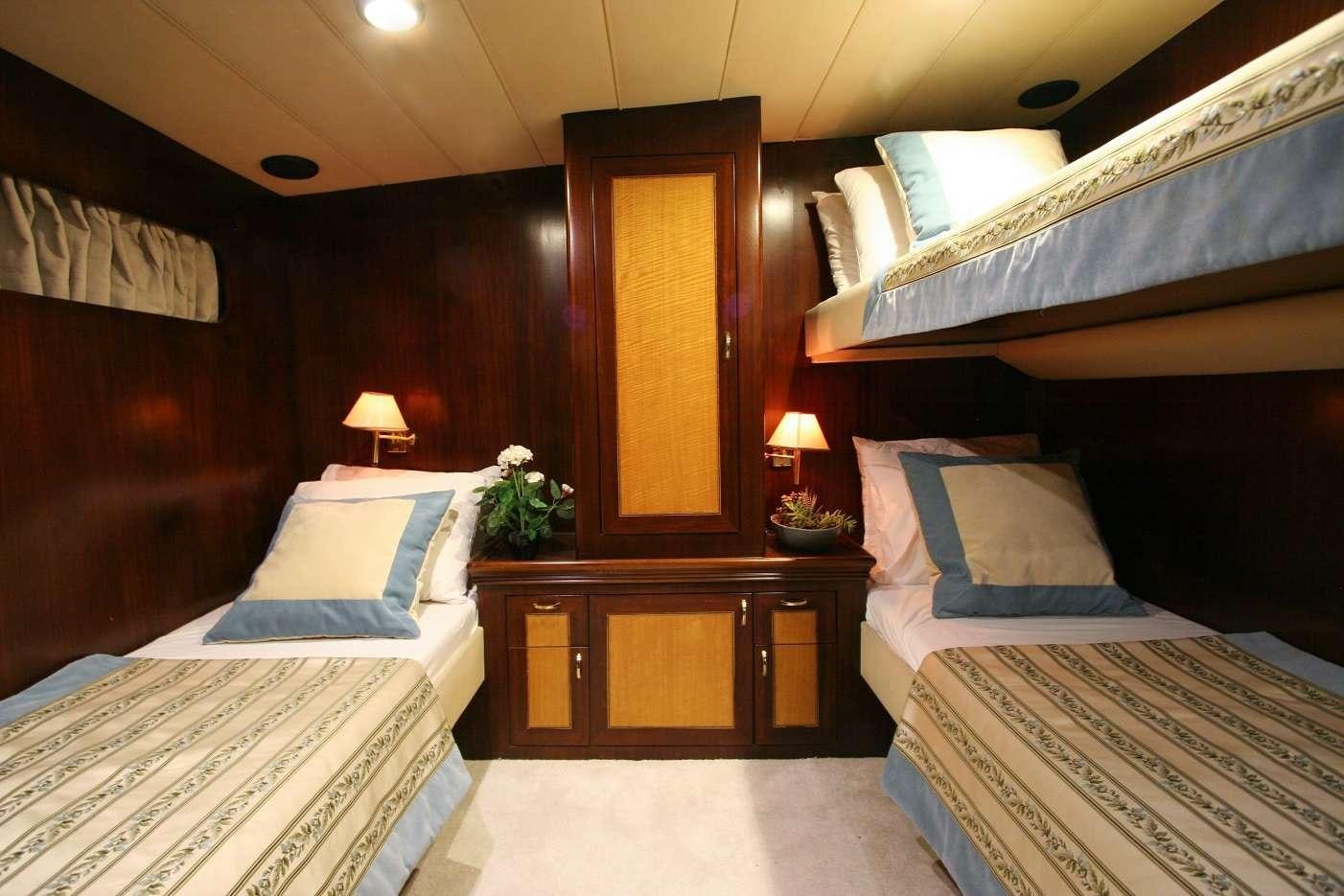 a room with two beds aboard CANEREN Yacht for Charter