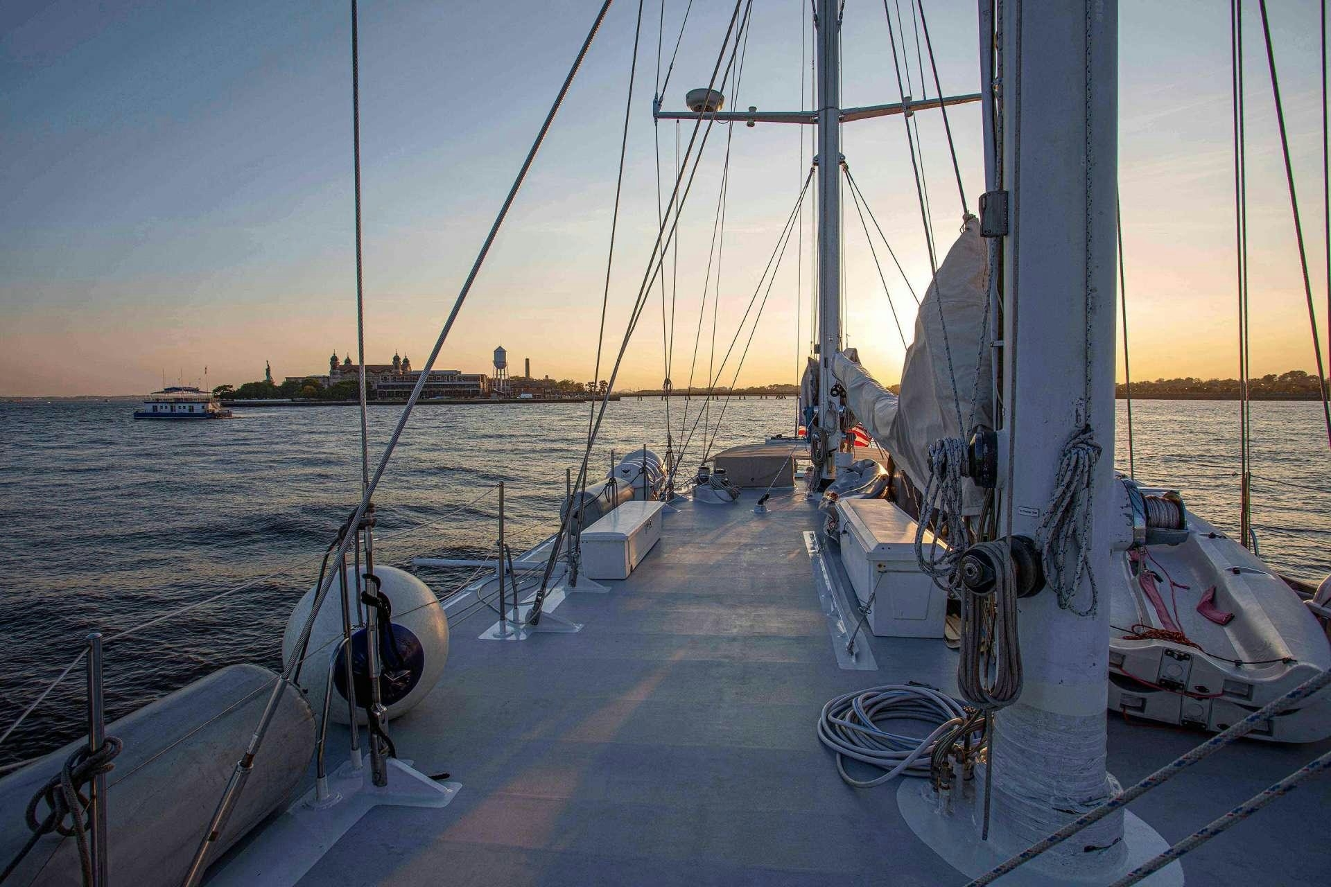 a group of boats are parked on the side of a body of water aboard ARABELLA II Yacht for Charter