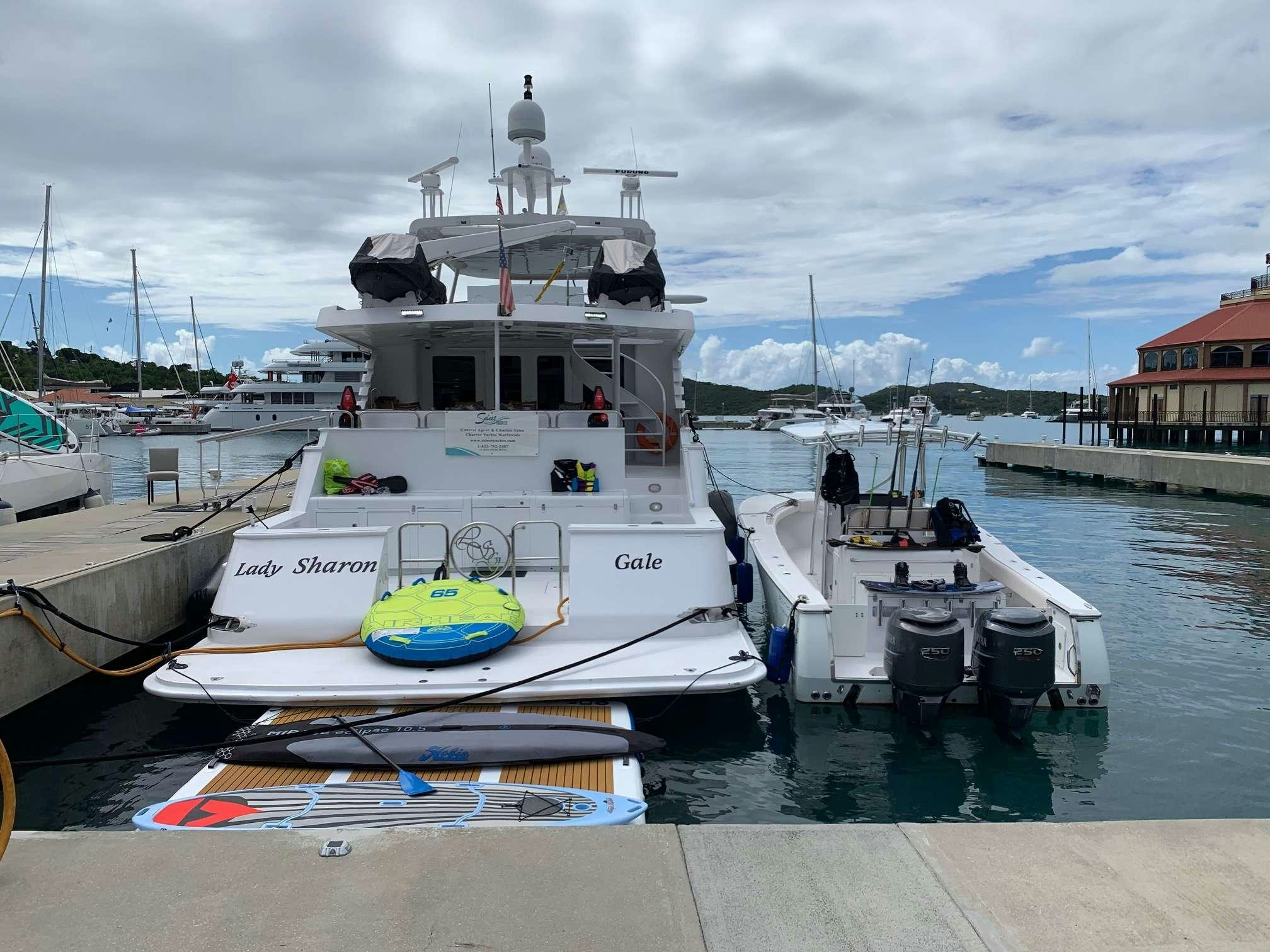a boat docked at a pier aboard DENISE ROSE Yacht for Charter