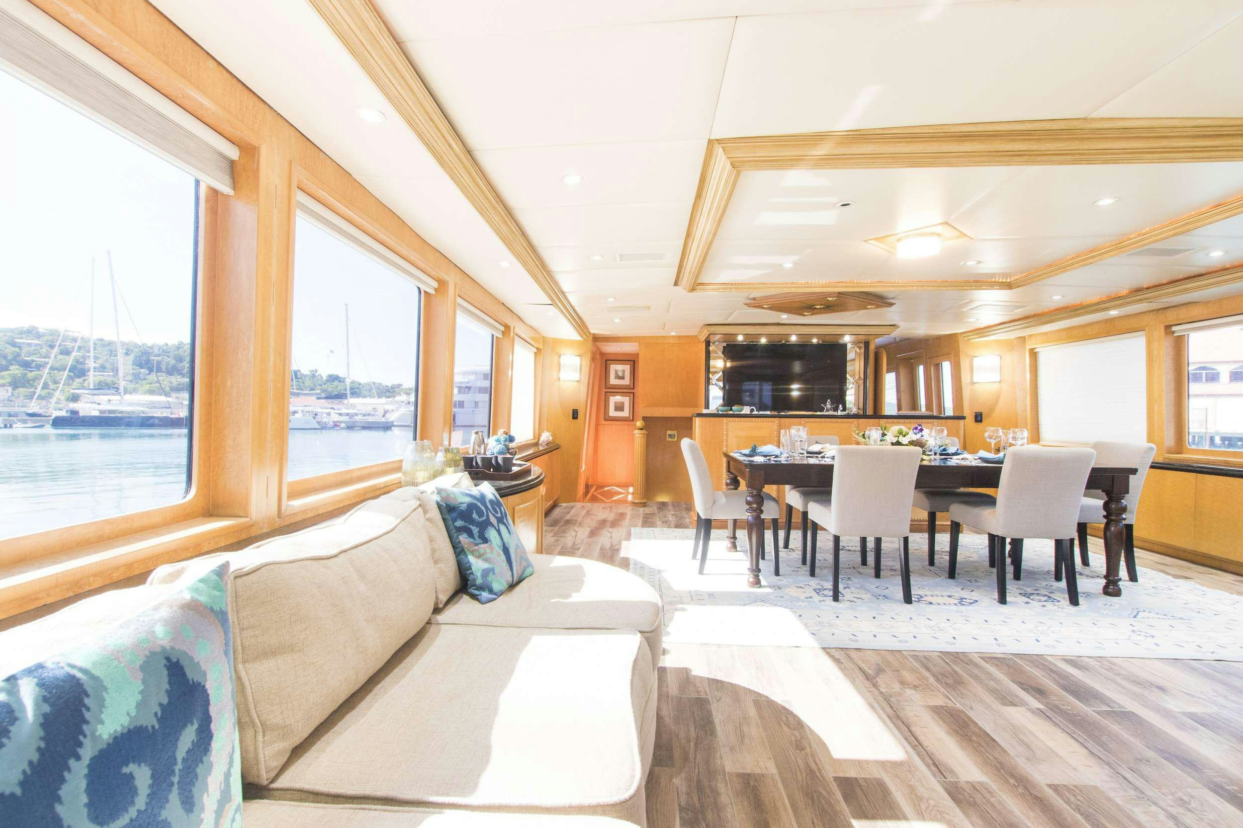 a living room with a couch and a table aboard DENISE ROSE Yacht for Charter