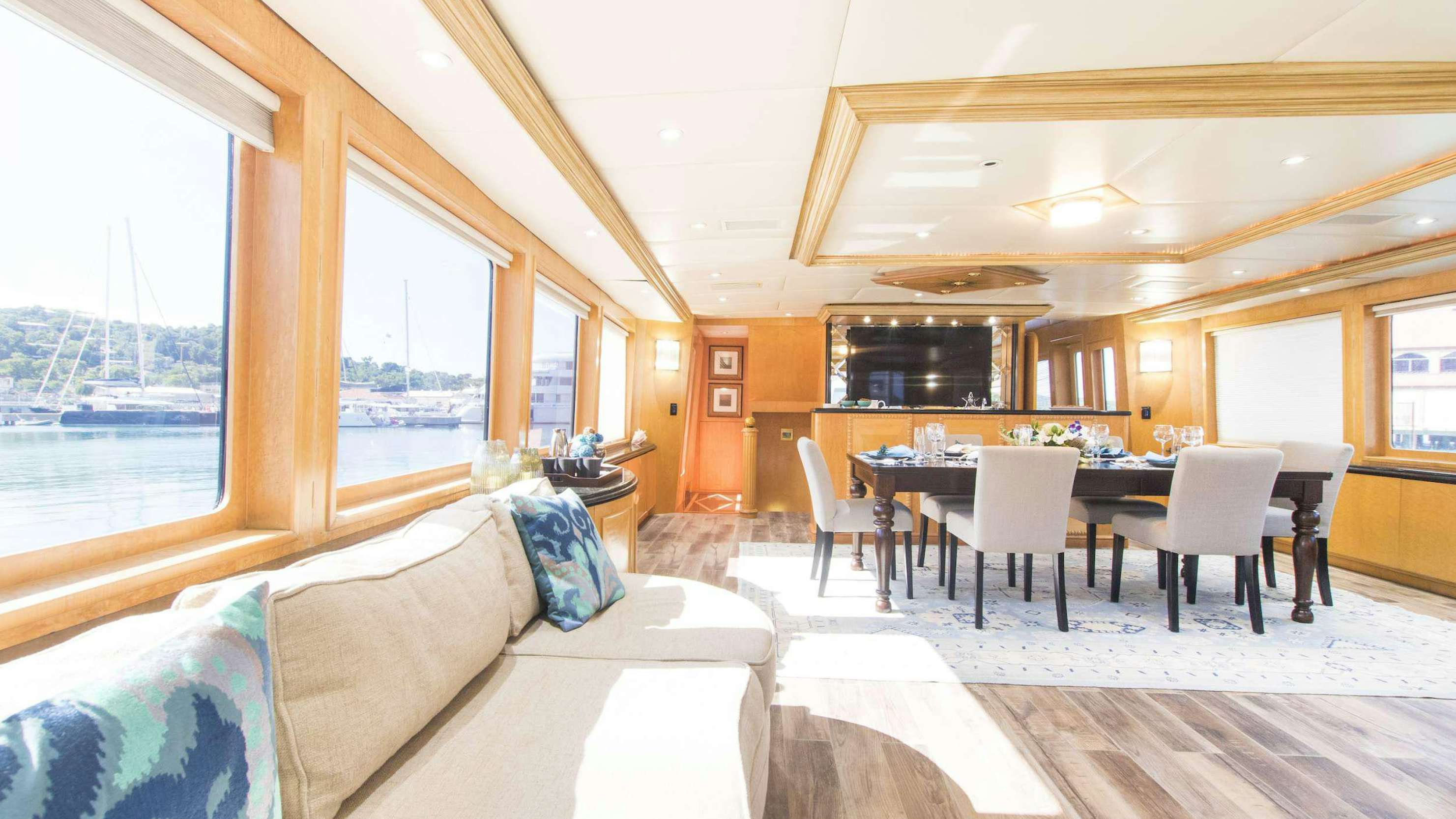 a living room with a couch and a table aboard LADY SHARON GALE Yacht for Charter