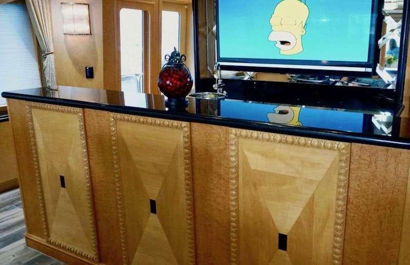 a tv on a cabinet aboard DENISE ROSE Yacht for Charter