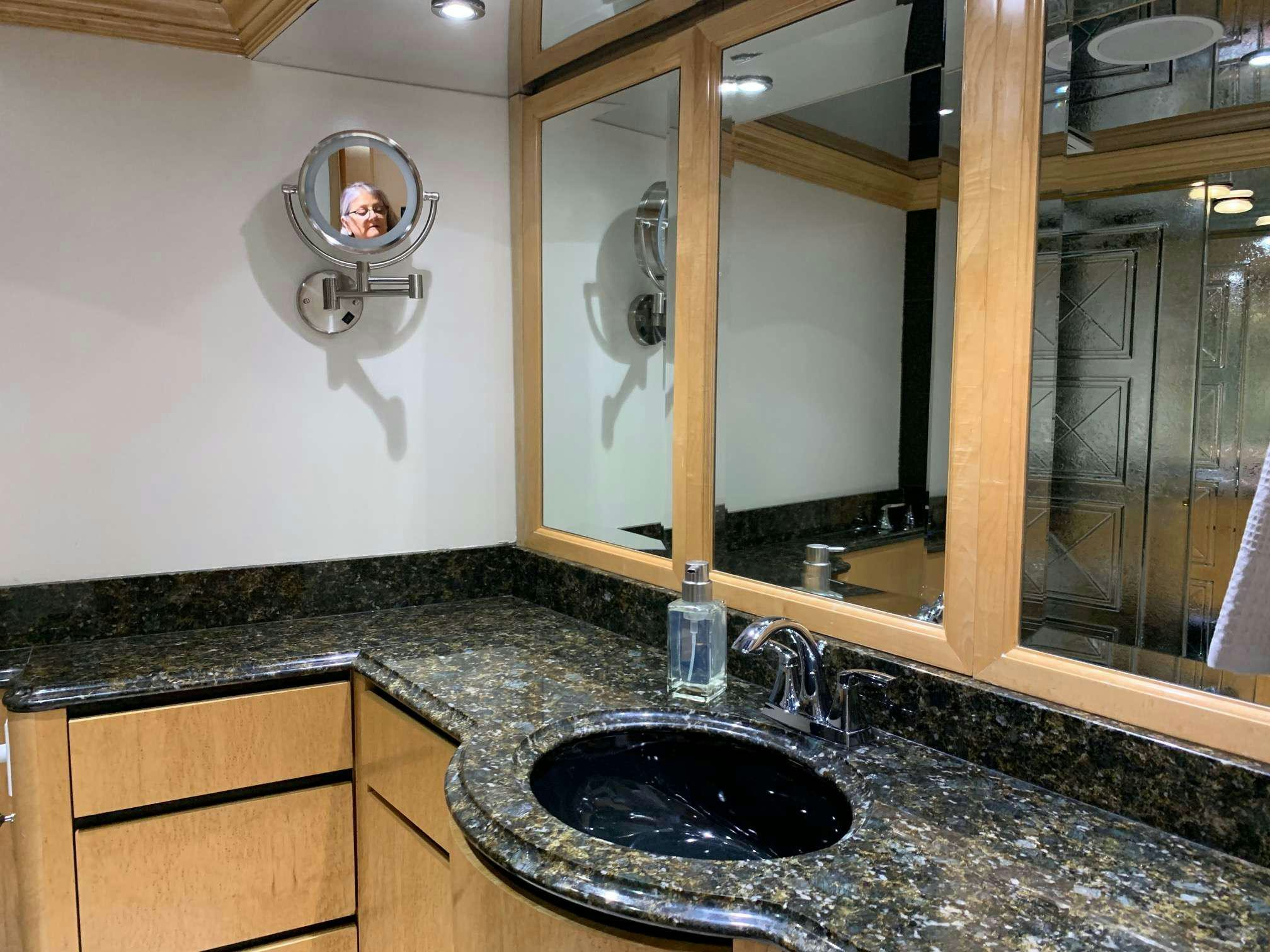 a bathroom with a marble countertop aboard DENISE ROSE Yacht for Charter