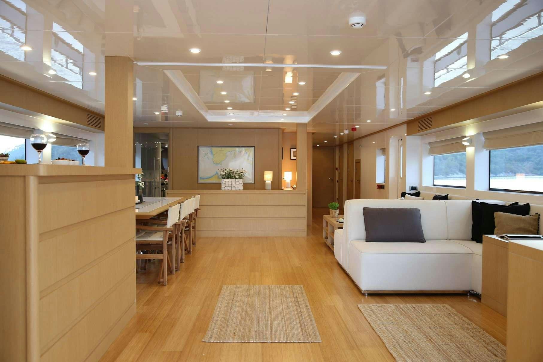 a room with a couch and a table aboard OTTAWA IV Yacht for Charter