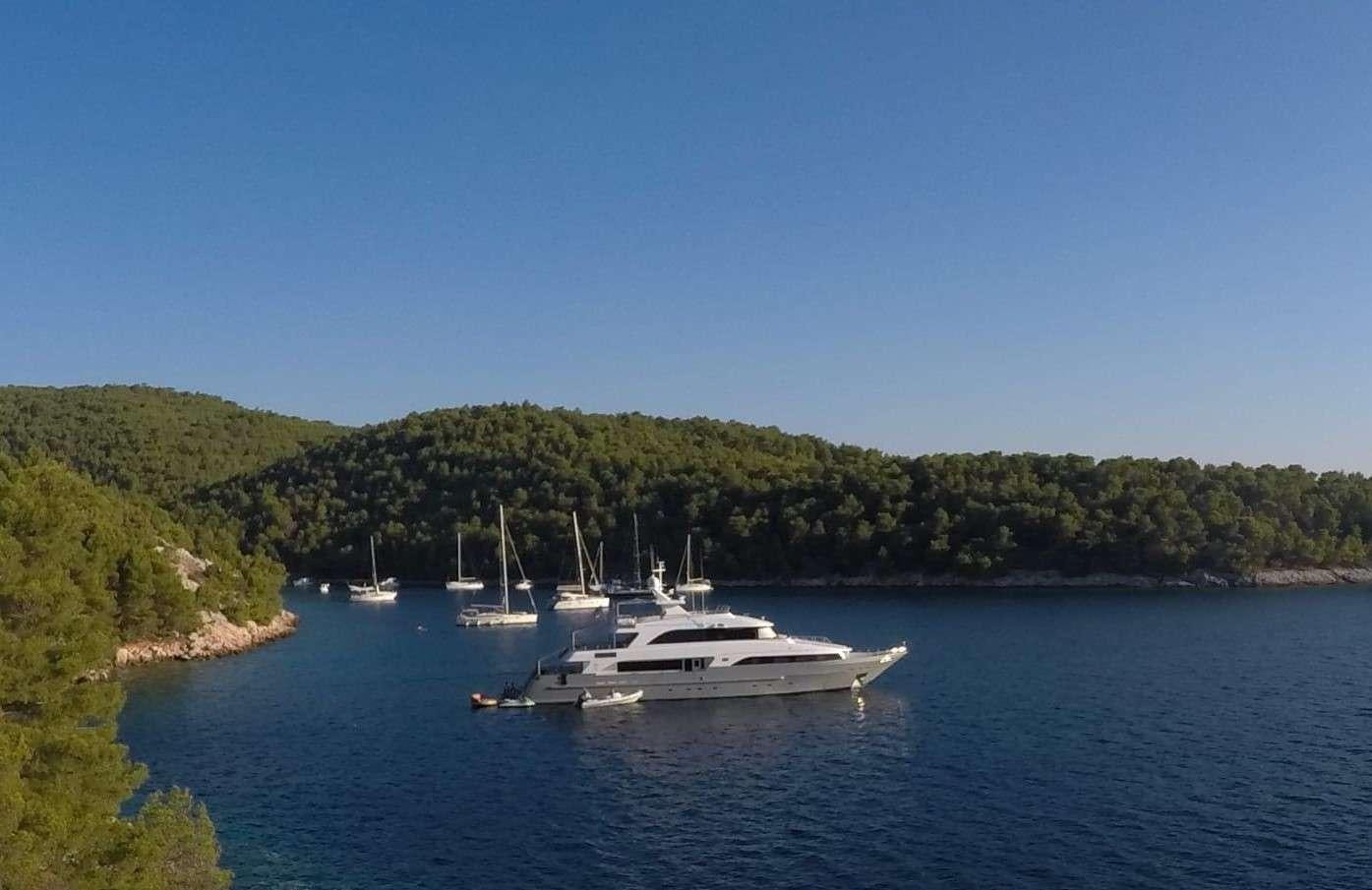 a group of boats on a body of water aboard OTTAWA IV Yacht for Charter