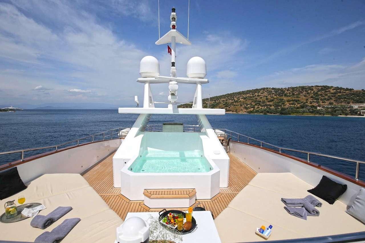 a pool on a deck overlooking the ocean aboard OTTAWA IV Yacht for Charter