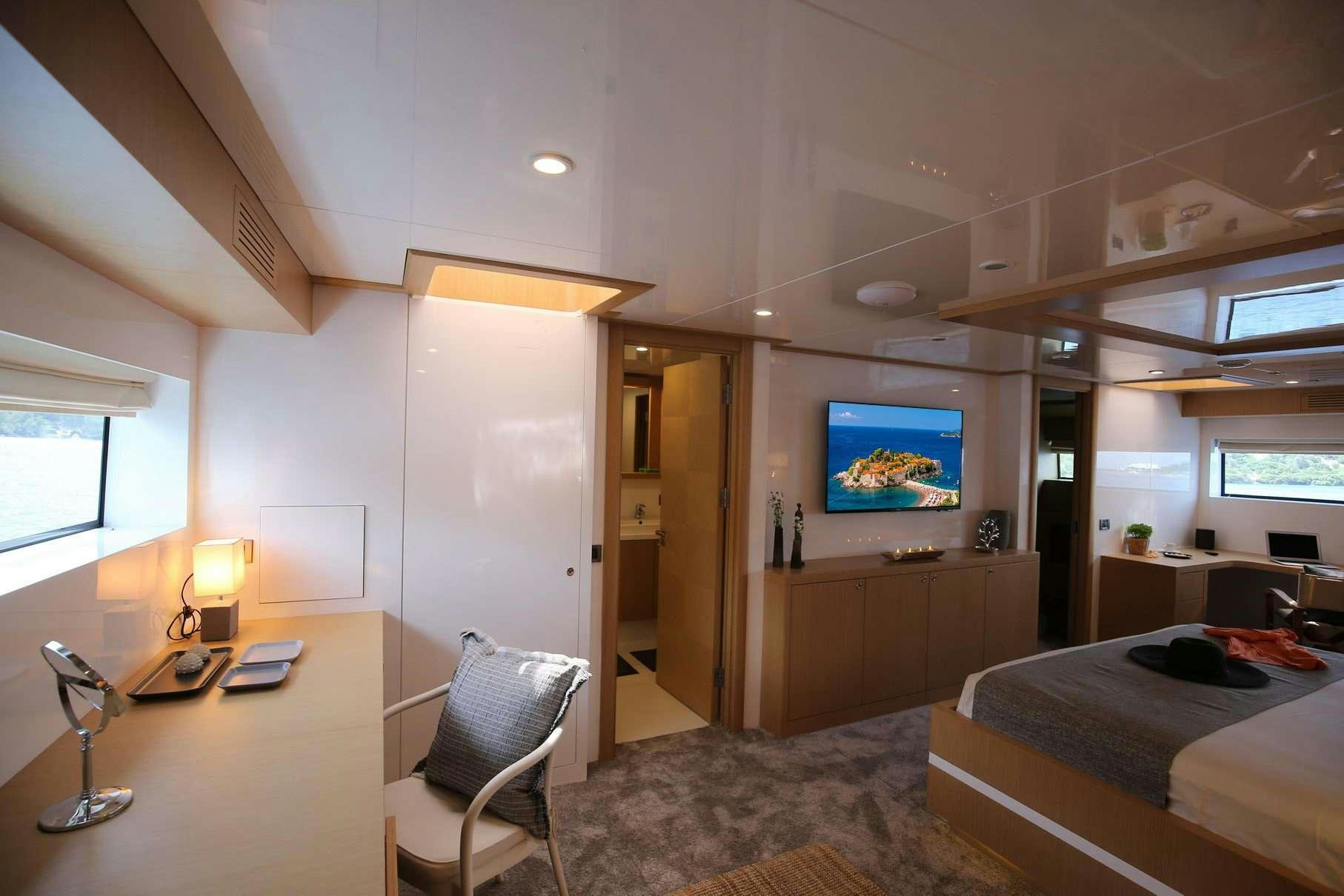 a bedroom with a tv on the wall aboard OTTAWA IV Yacht for Charter