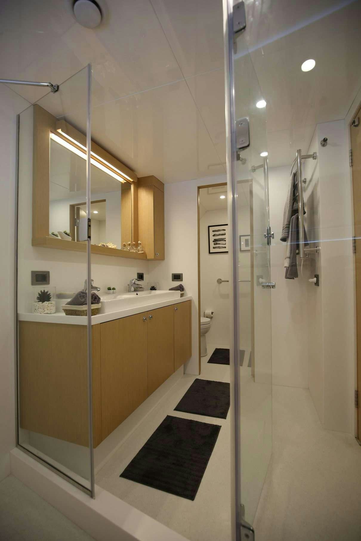 a bathroom with a shower unit aboard OTTAWA IV Yacht for Charter