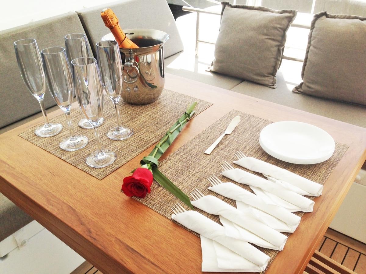 a table with napkins and glasses aboard COOL RUNNINGS IV Yacht for Charter