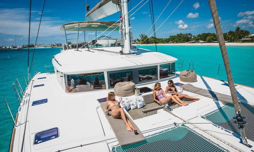 people sitting on a boat aboard COOL RUNNINGS IV Yacht for Charter