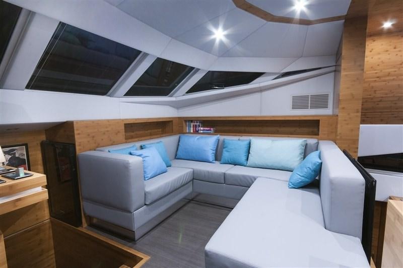 a room with a couch and a table aboard SKYLARK Yacht for Charter