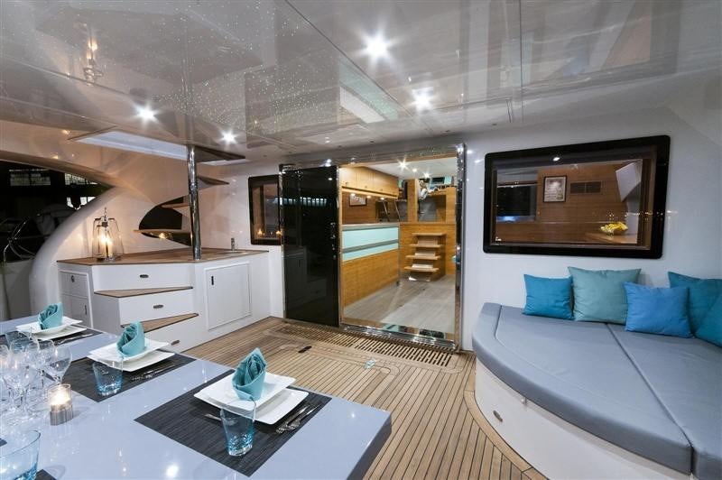 a room with a table and a couch aboard SKYLARK Yacht for Charter