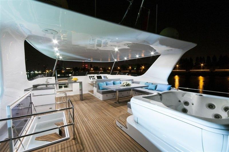 a large white room with a large white and black object on the ceiling aboard SKYLARK Yacht for Charter