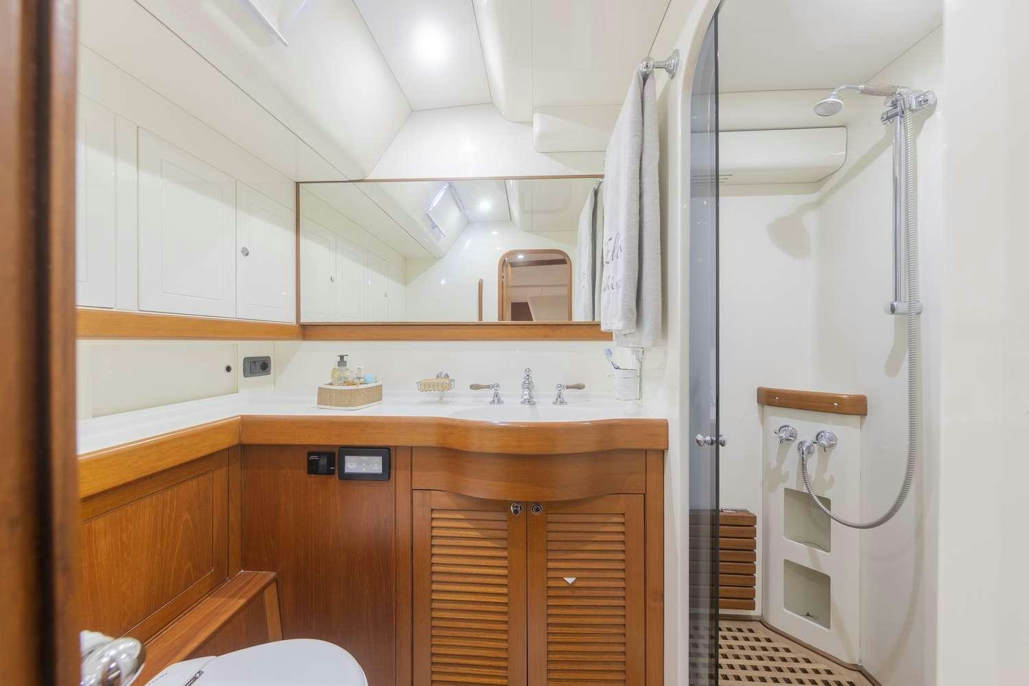 a bathroom with a shower unit and sink aboard ELISE WHISPER Yacht for Charter