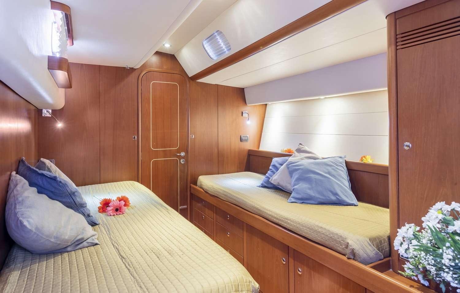 a room with two beds aboard ELISE WHISPER Yacht for Charter