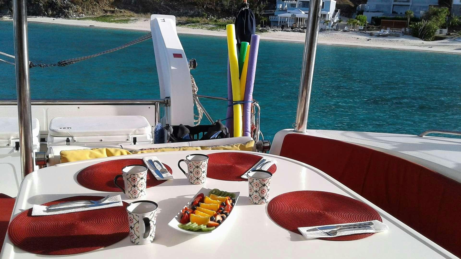 a boat with fruits and drinks on it aboard ELIXIR Yacht for Charter