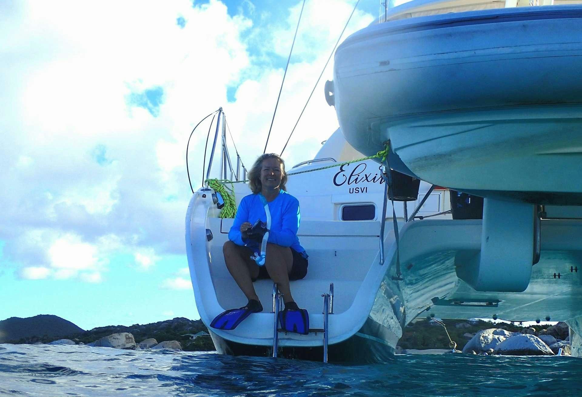 a man sitting on a boat aboard ELIXIR Yacht for Charter