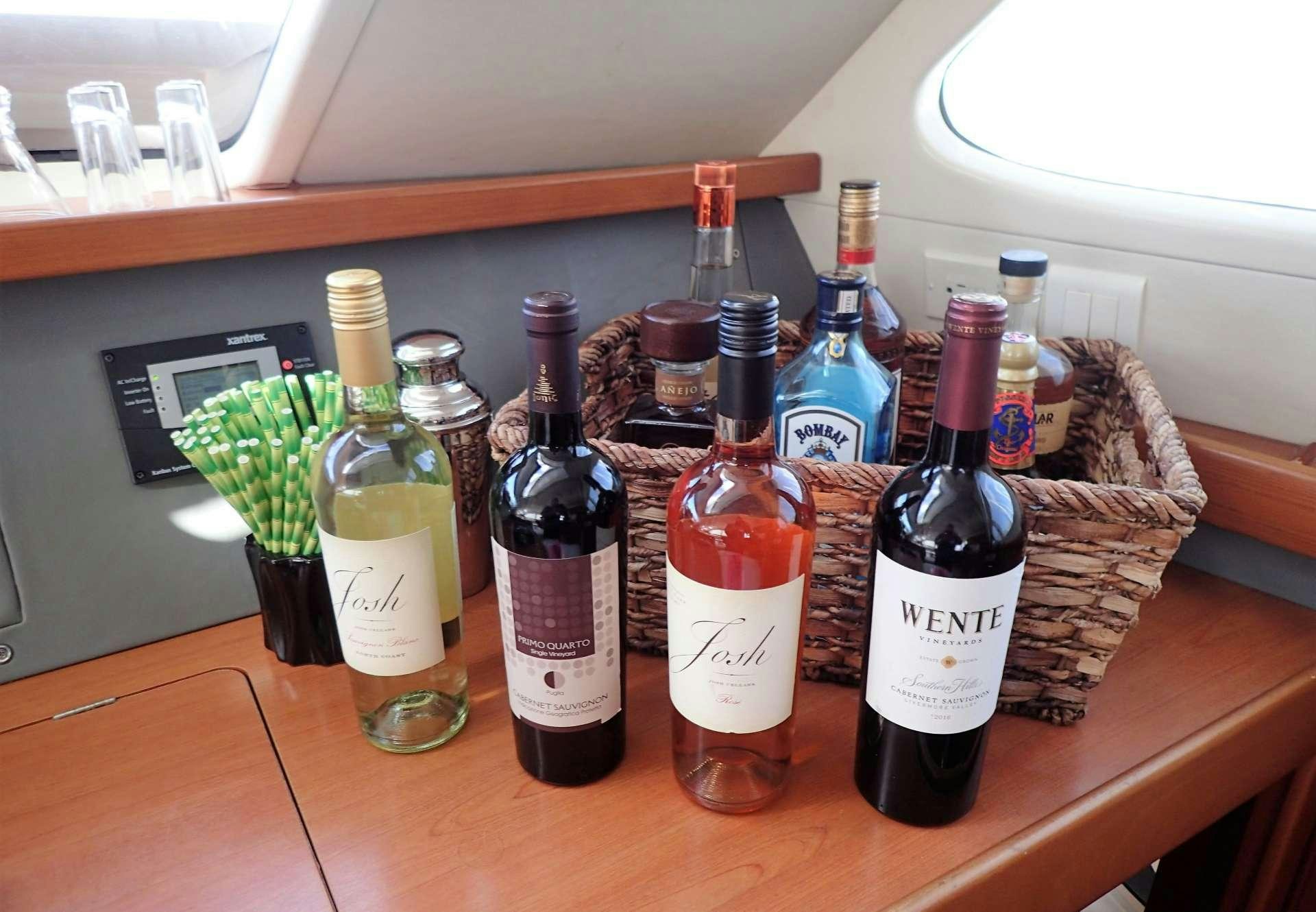 a group of bottles on a table aboard ELIXIR Yacht for Charter