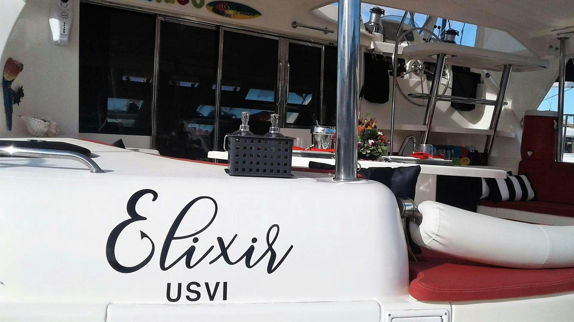 a table with chairs and a sign aboard ELIXIR Yacht for Charter