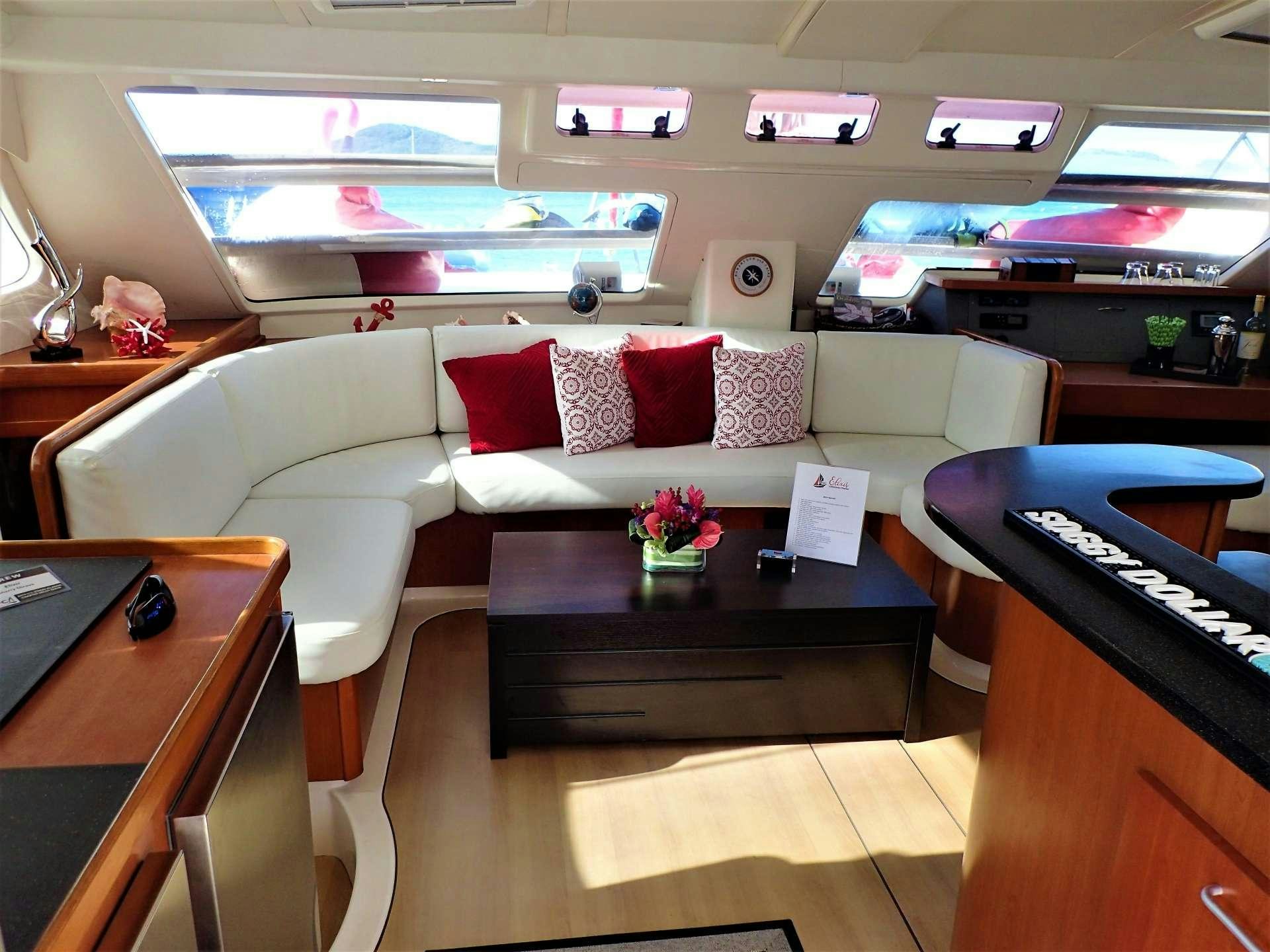 a living room with a couch and a piano aboard ELIXIR Yacht for Charter