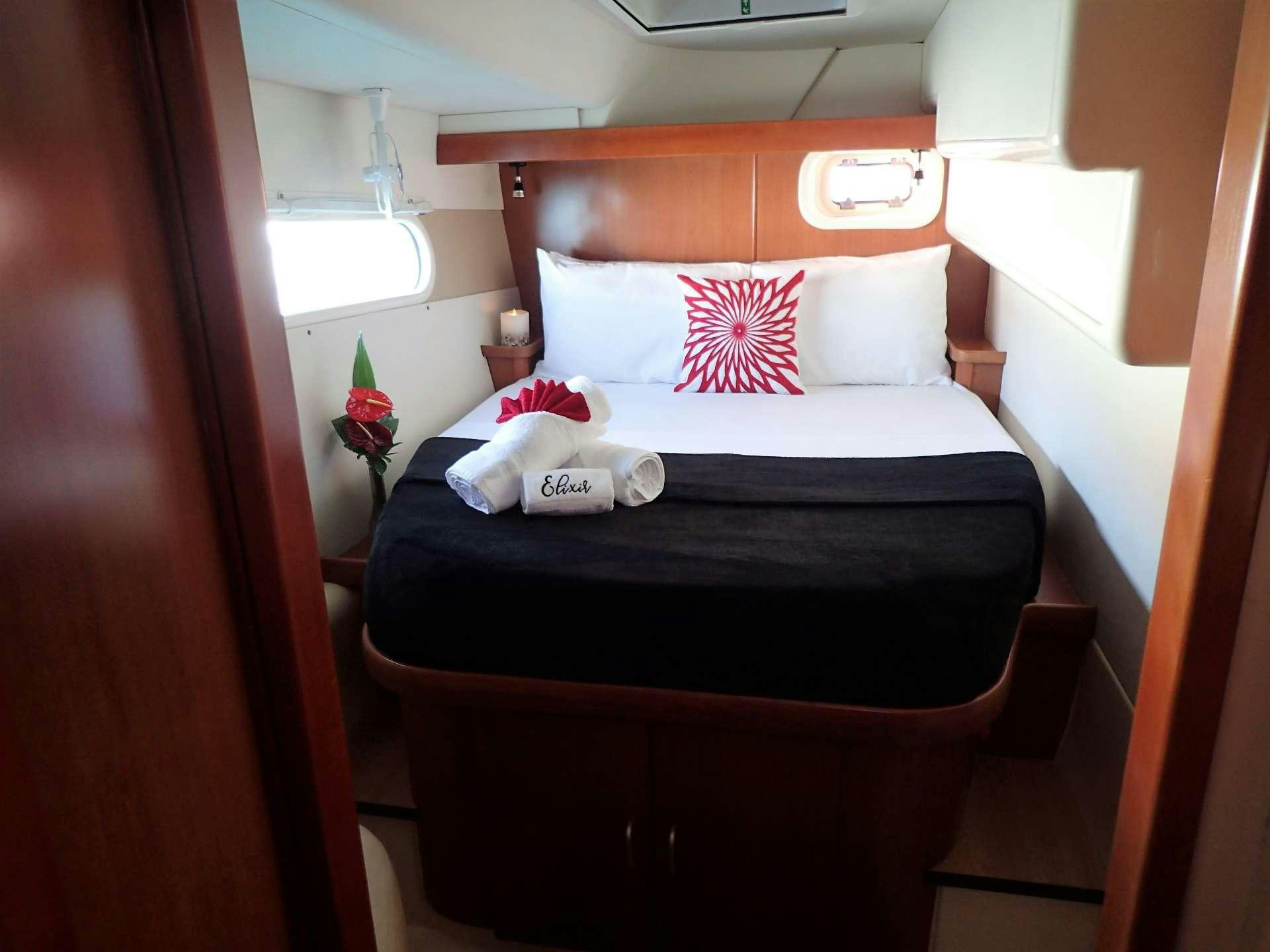 a bed with pillows aboard ELIXIR Yacht for Charter