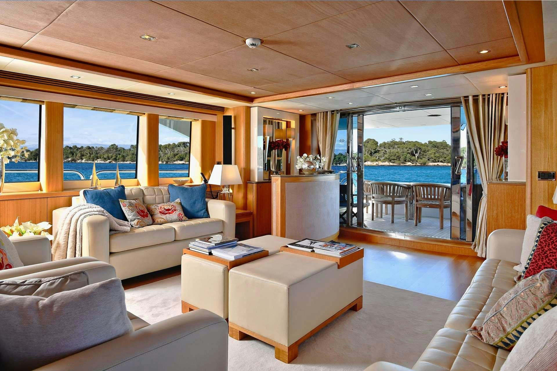 a living room with a large window aboard TENACITY Yacht for Charter