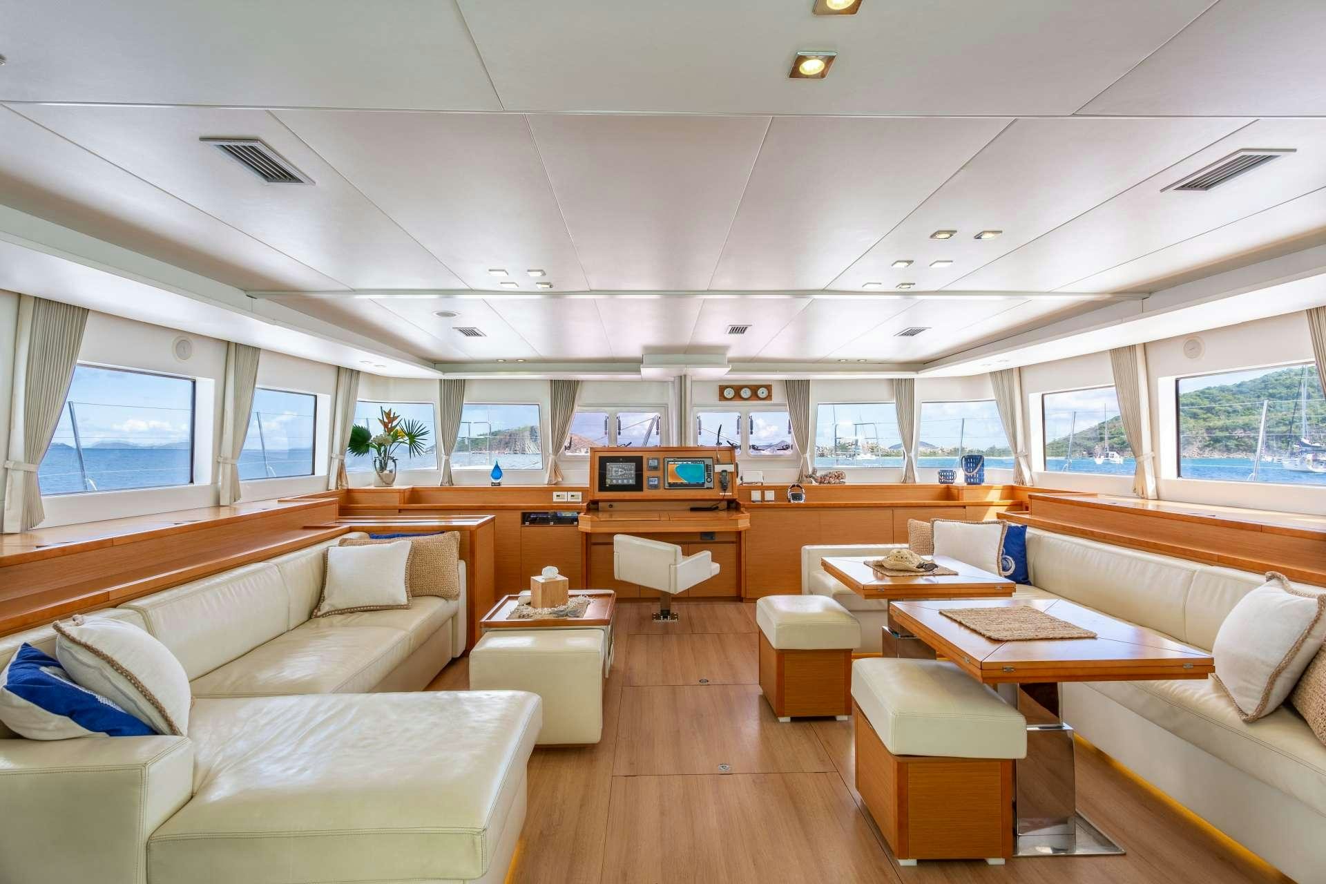 a room with a couch and a table aboard SERENITY NOW Yacht for Charter