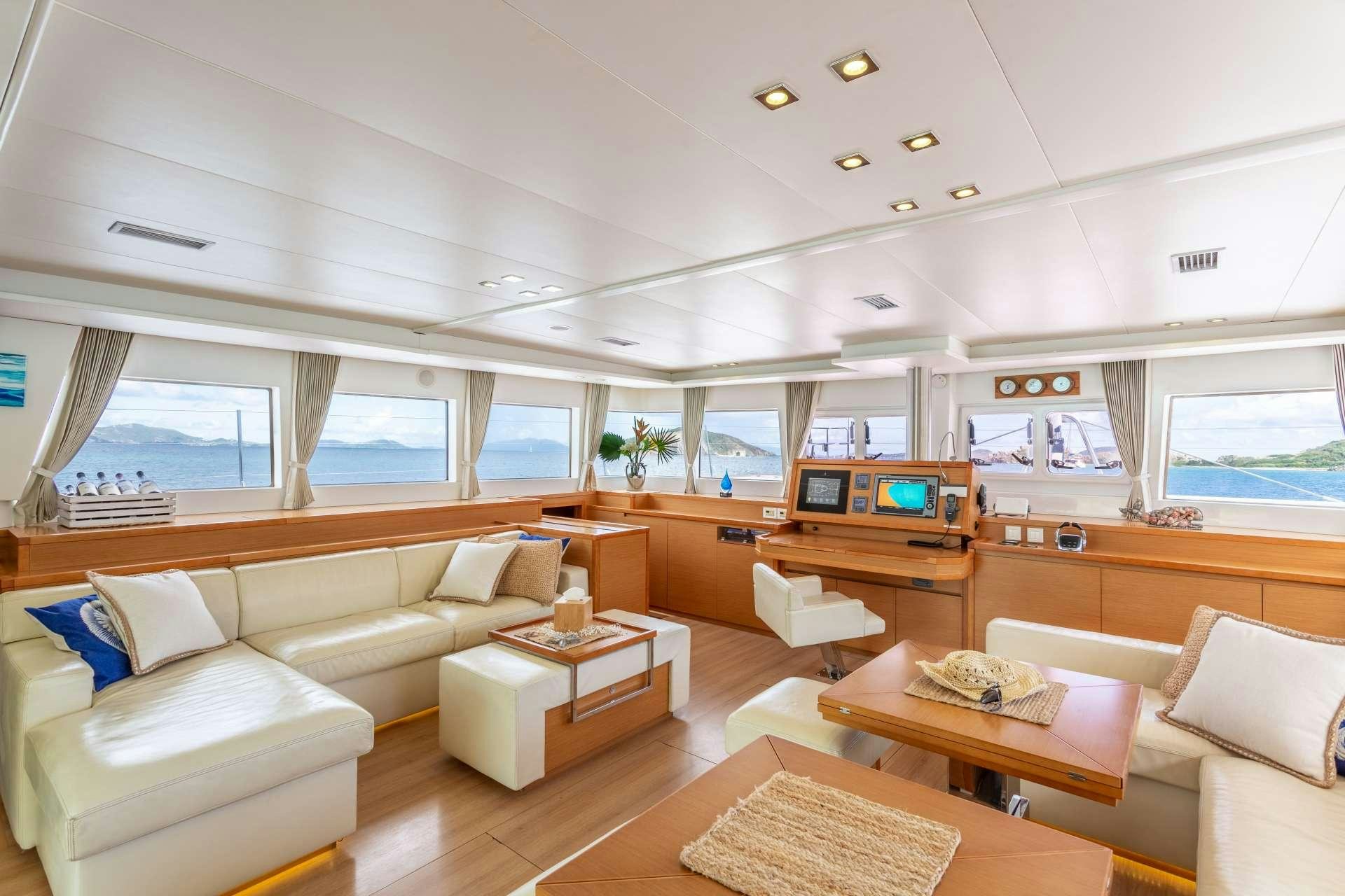 a living room with a couch and a table aboard SERENITY NOW Yacht for Charter