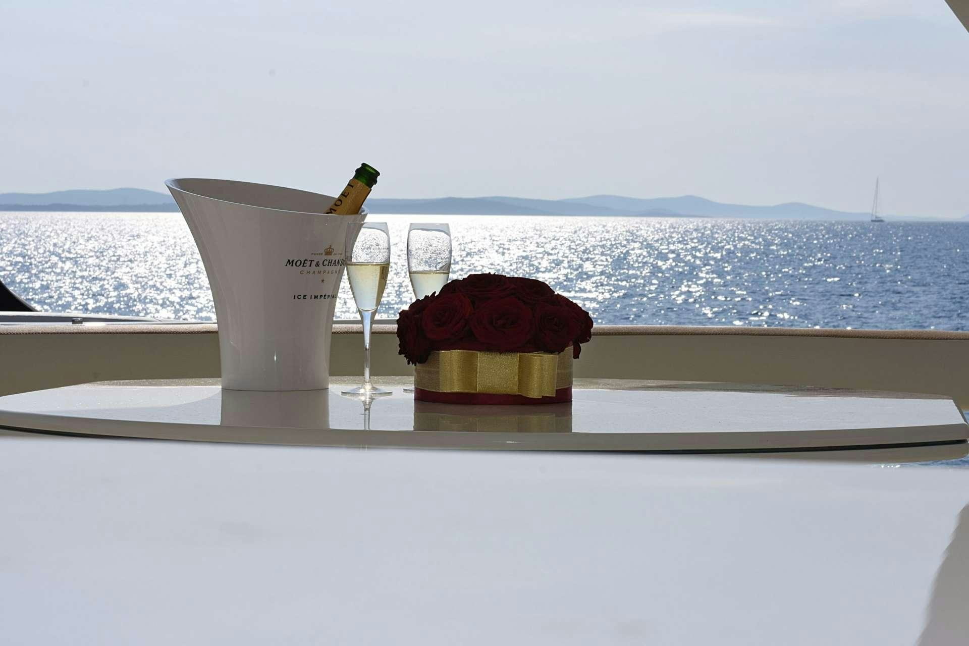 a rose on a table aboard TESORO Yacht for Charter