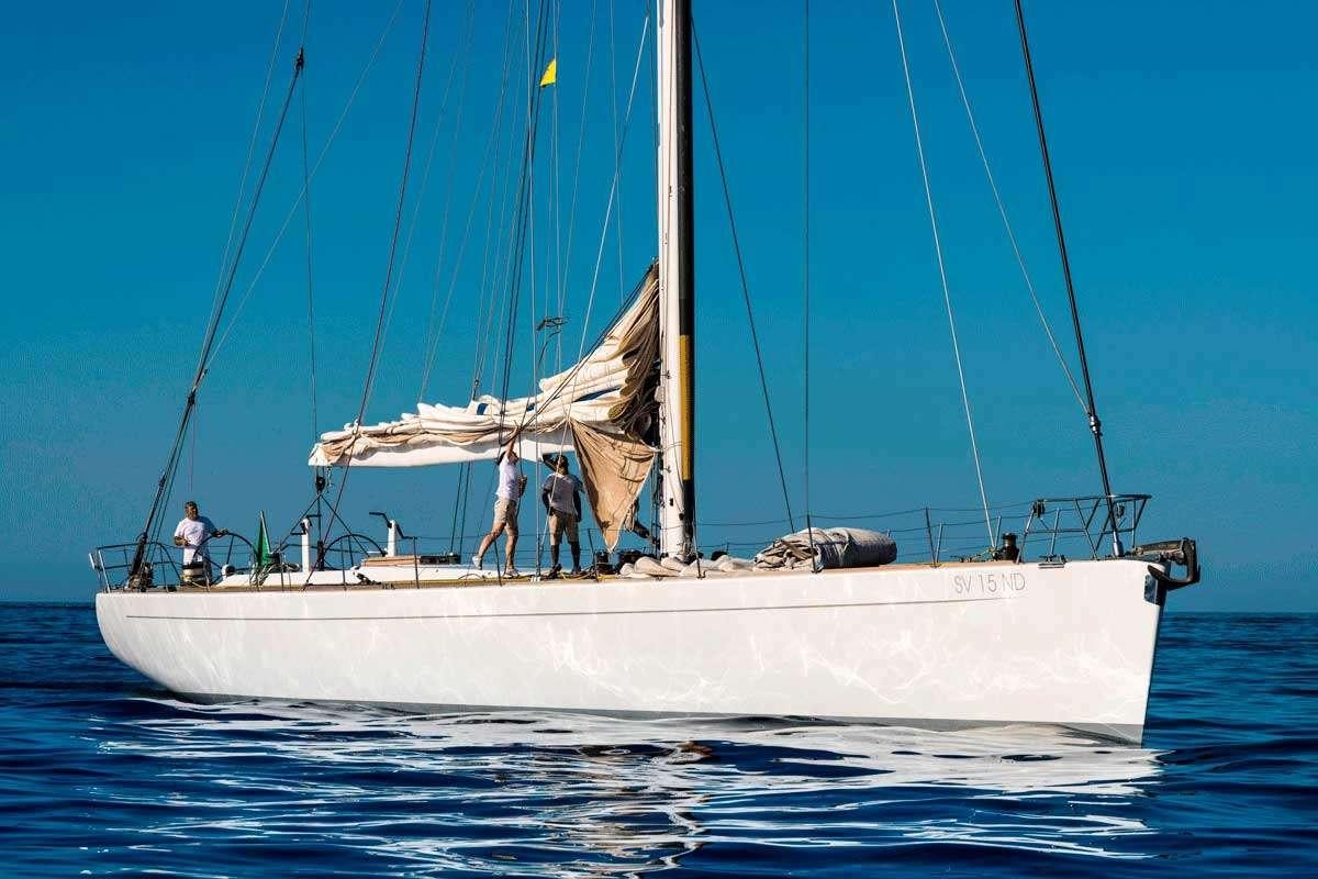 a sailboat with people on it aboard LOGICA/QUINTA SANTA MARIA Yacht for Charter