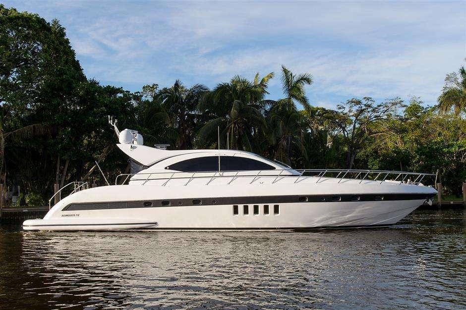 a white boat on the water aboard YCM Yacht for Charter