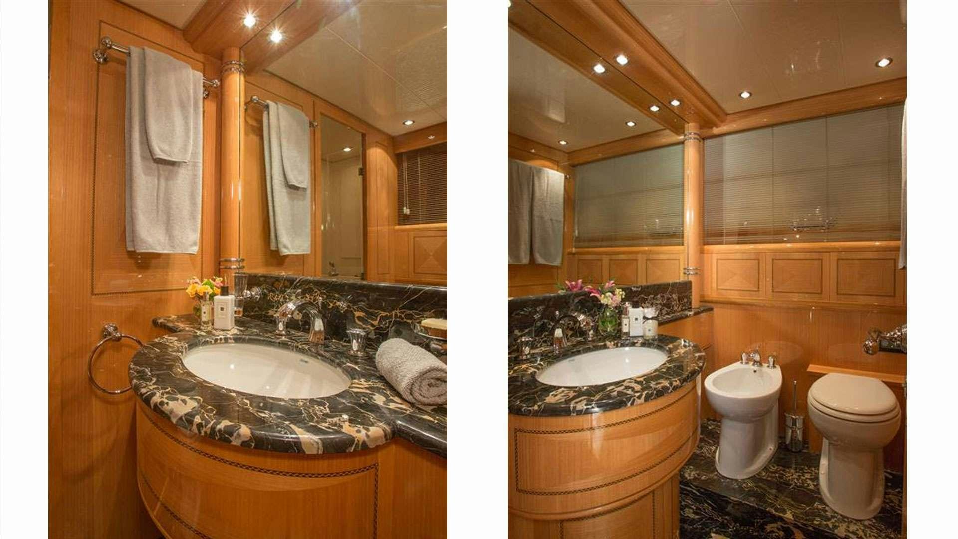 a bathroom with a large countertop aboard YCM Yacht for Charter
