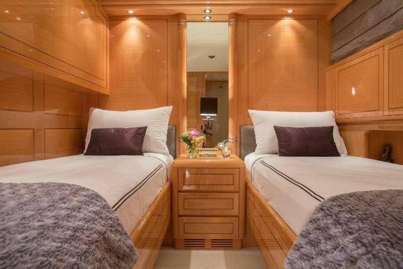 a room with two beds aboard YCM Yacht for Charter