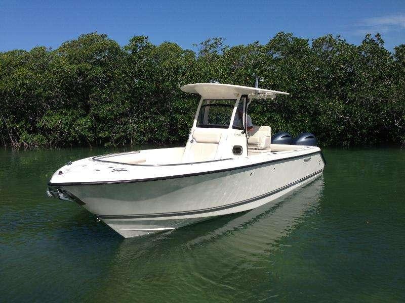 a white boat in the water aboard INTERVENTION Yacht for Charter