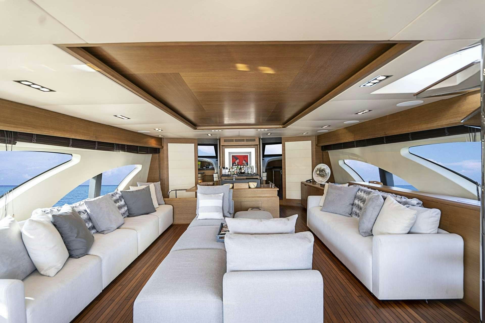 a living room with a large window aboard INTERVENTION Yacht for Charter