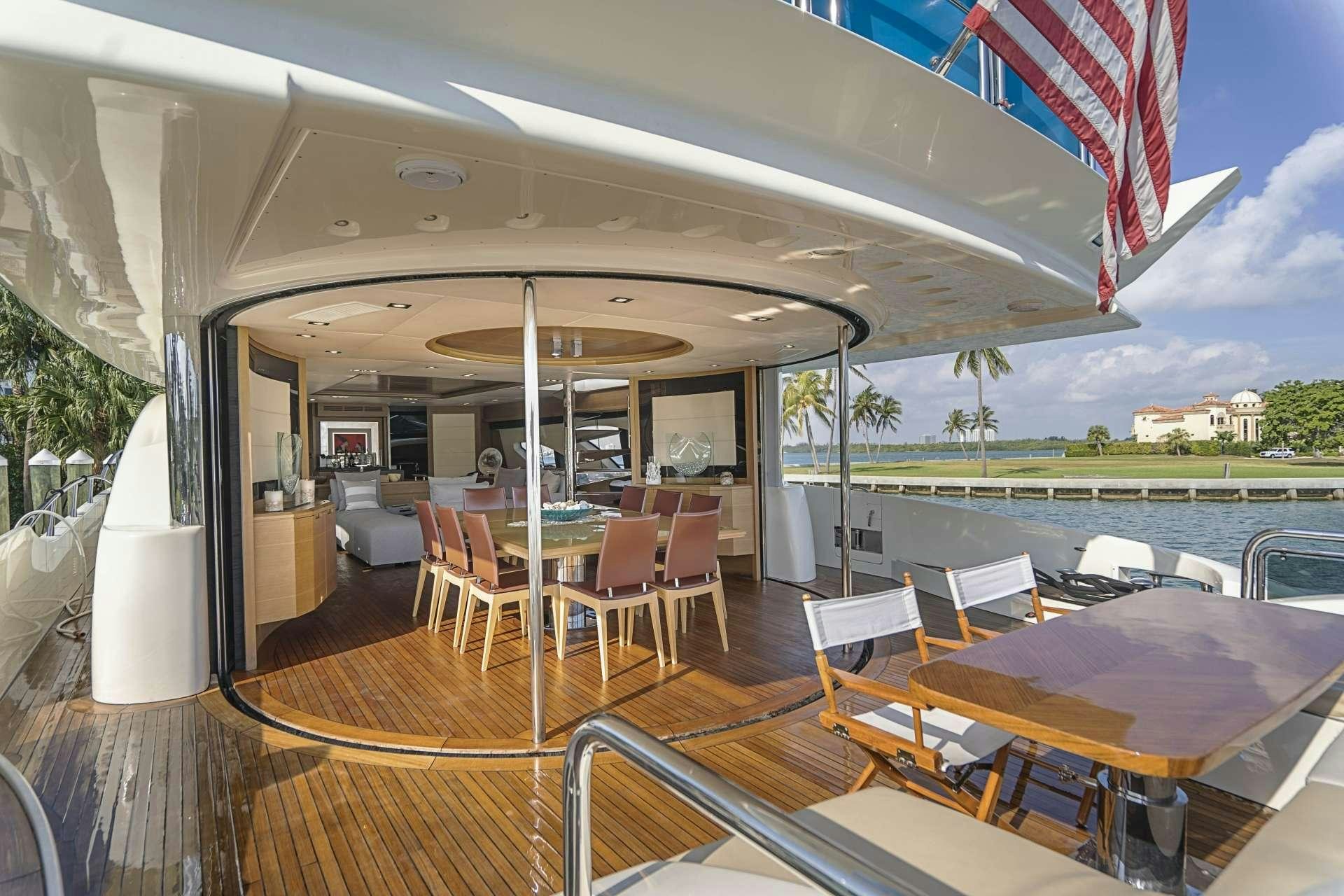a boat with tables and chairs aboard INTERVENTION Yacht for Charter