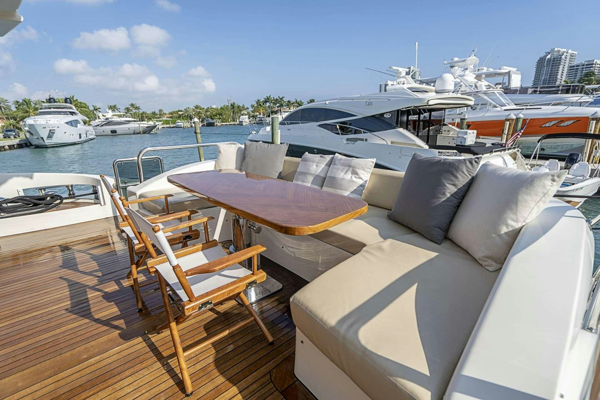 a boat dock with many boats aboard INTERVENTION Yacht for Charter