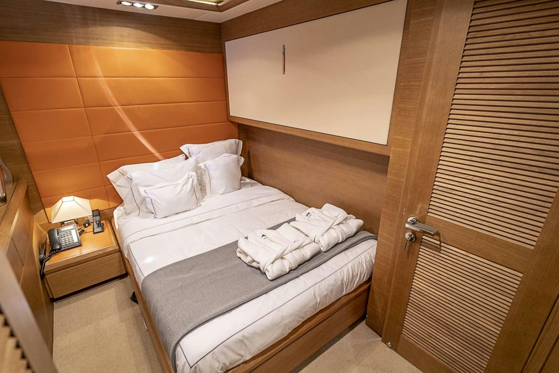 a bed in a room aboard INTERVENTION Yacht for Charter