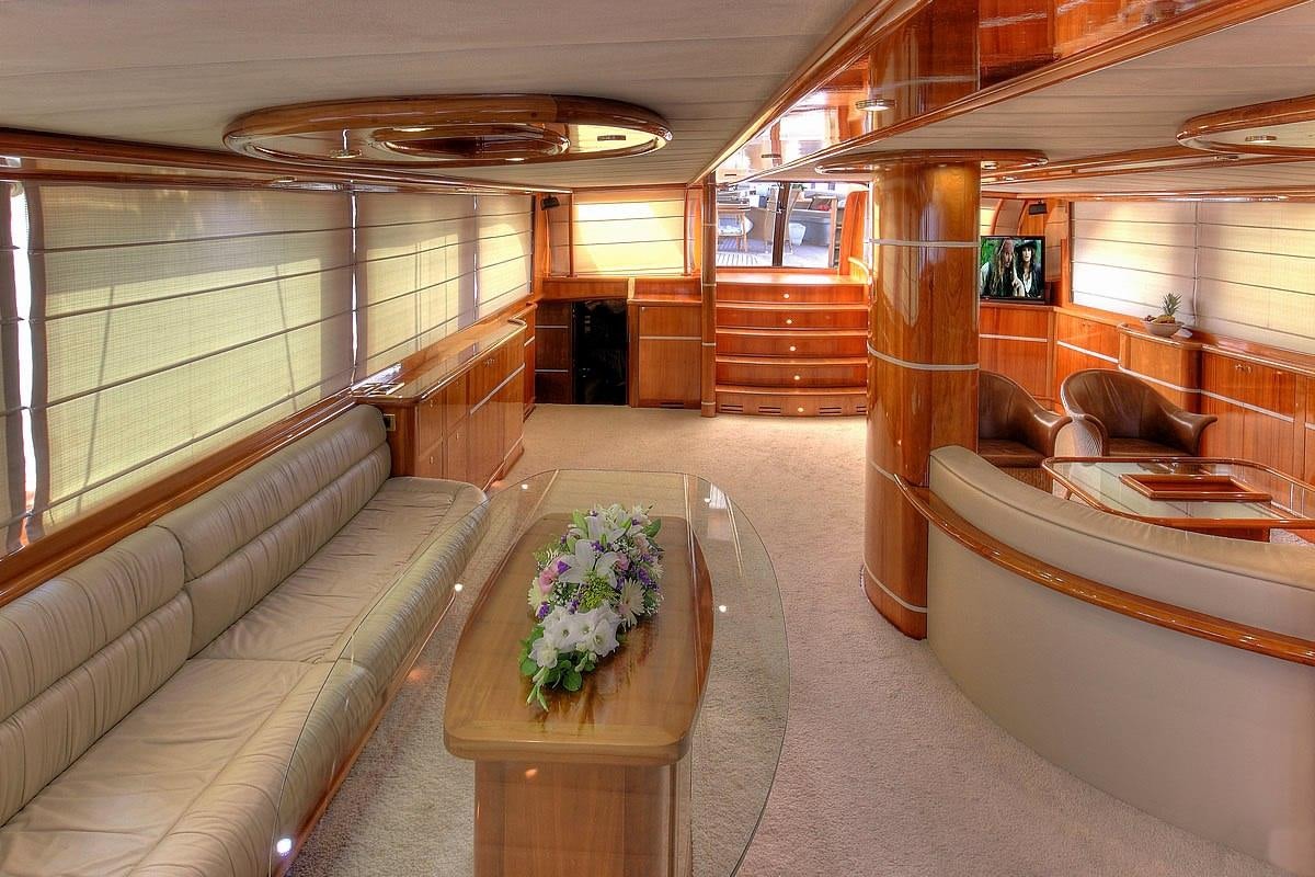 a room with a table and chairs aboard SILVER MOON Yacht for Charter