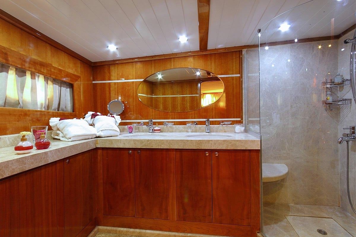 a bathroom with a large mirror aboard SILVER MOON Yacht for Charter