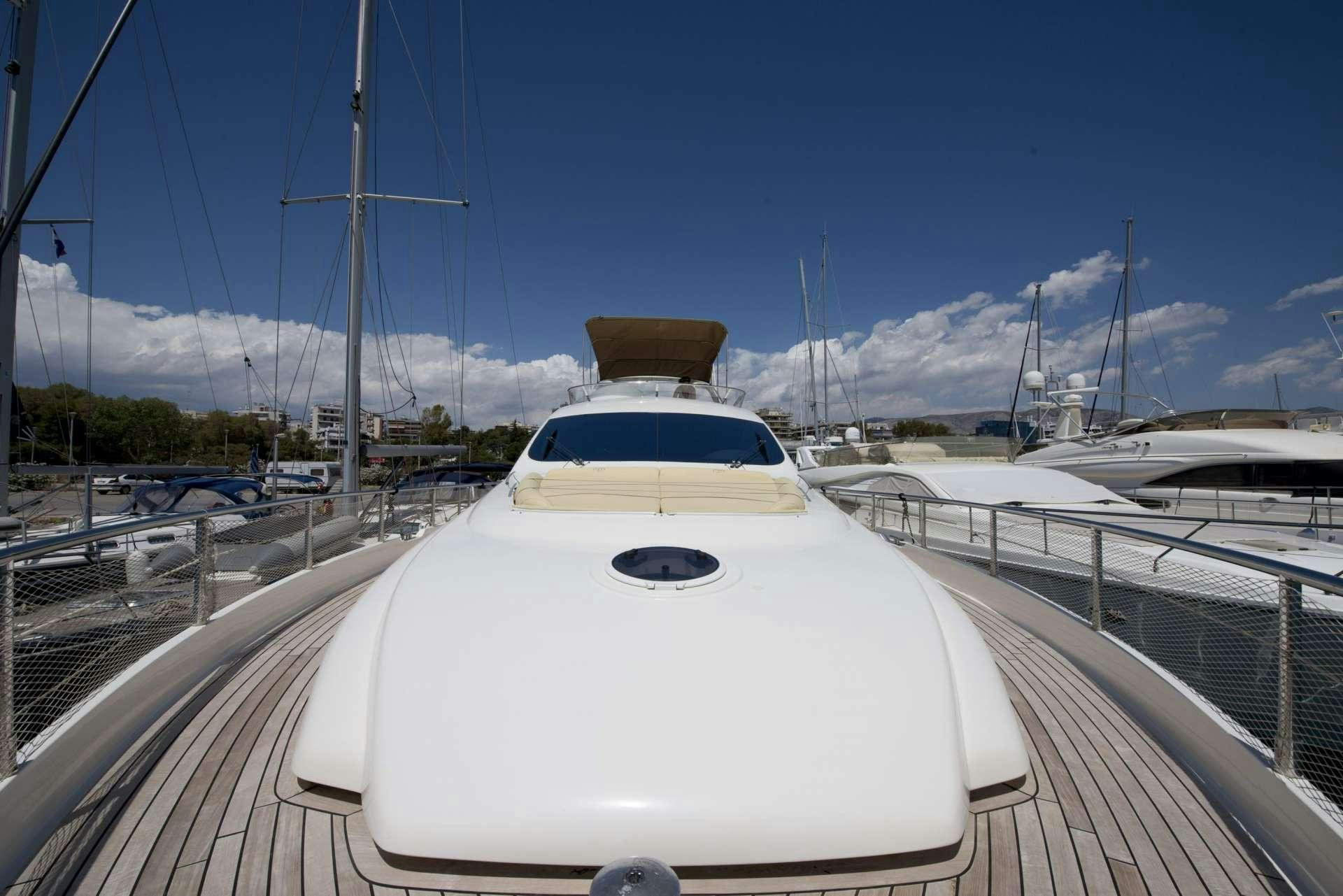 a white car on a bridge aboard JULY Yacht for Charter