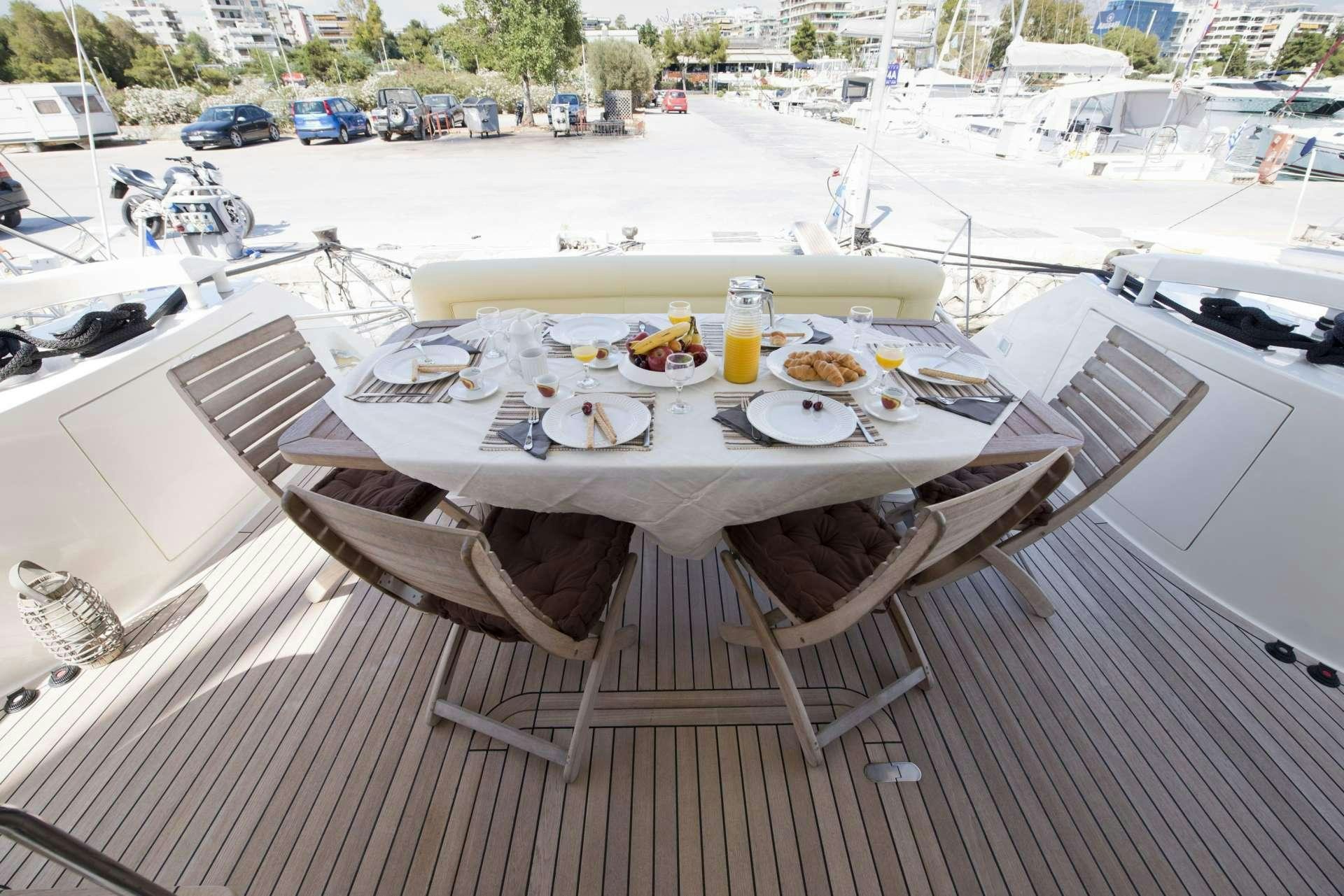 a table with food on it aboard JULY Yacht for Charter