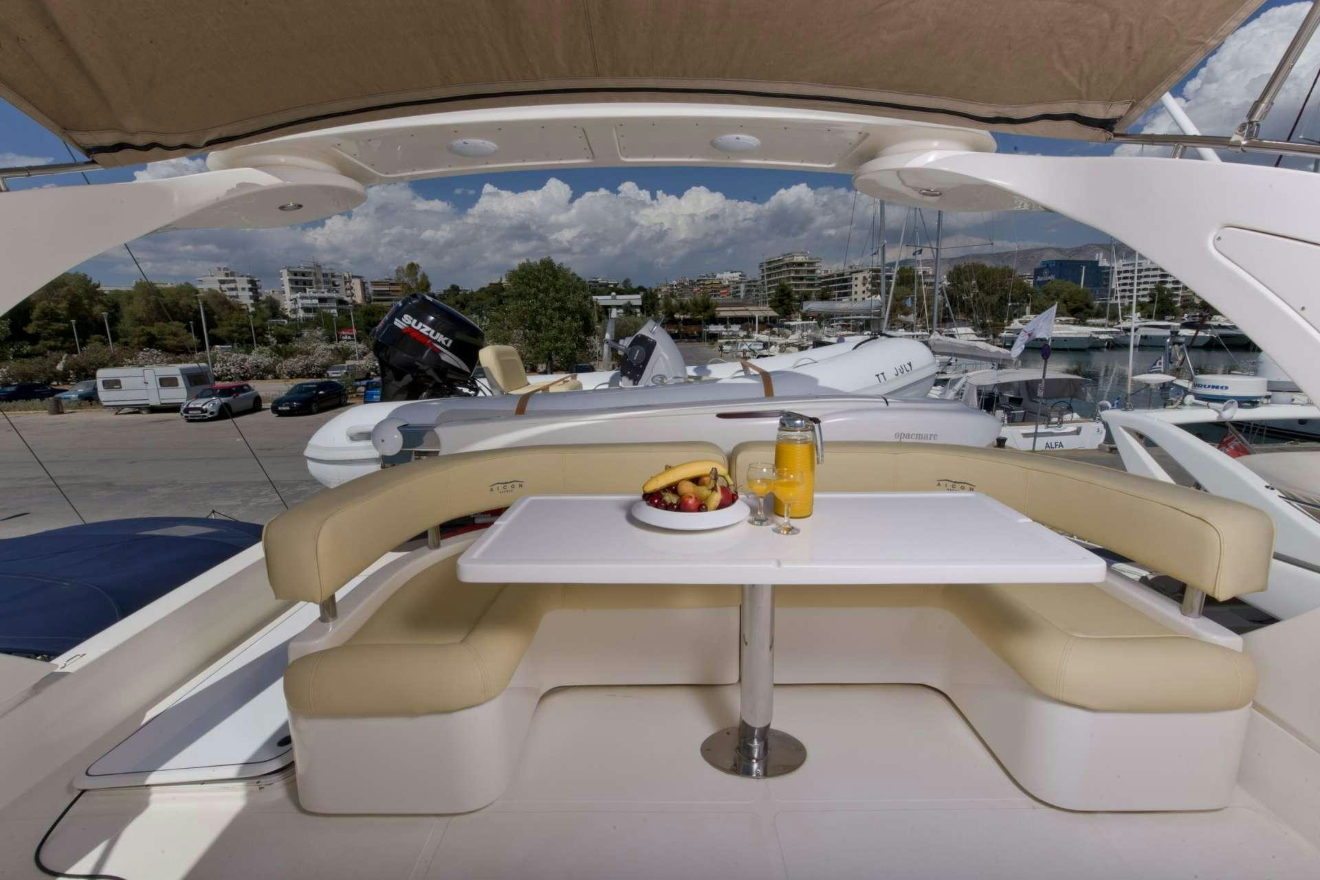 a table with food and drinks on it aboard JULY Yacht for Charter
